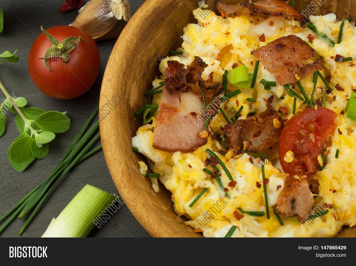 english breakfast. toast and scrambled eggs with chives.