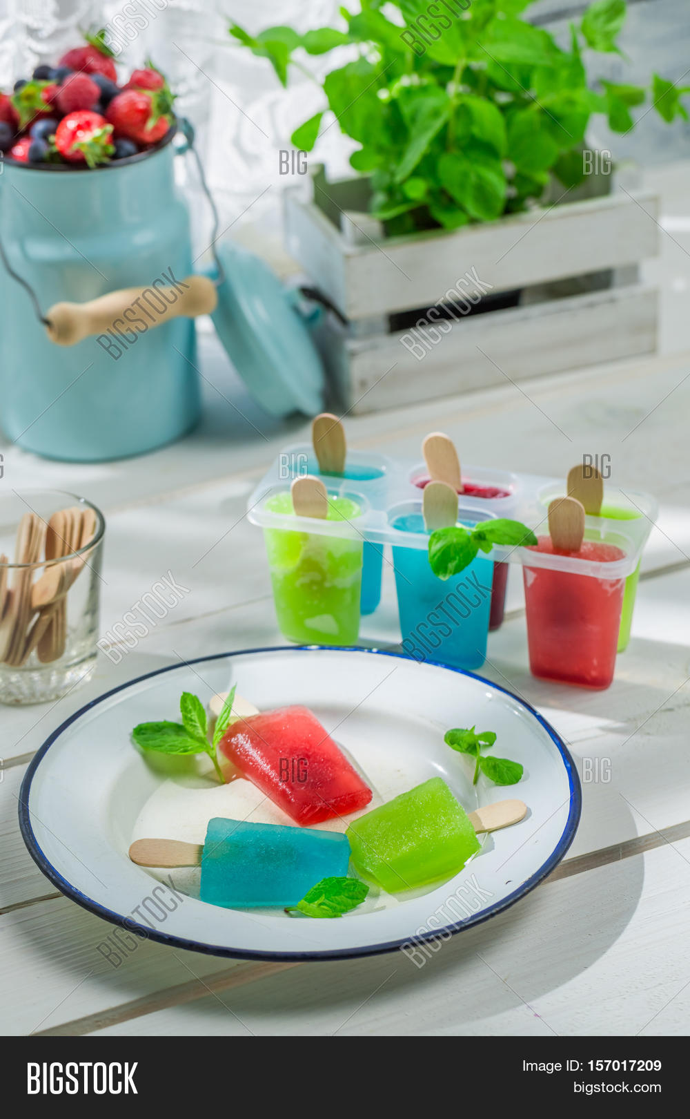 colorfull ice cream with fruity yogurt on old white table