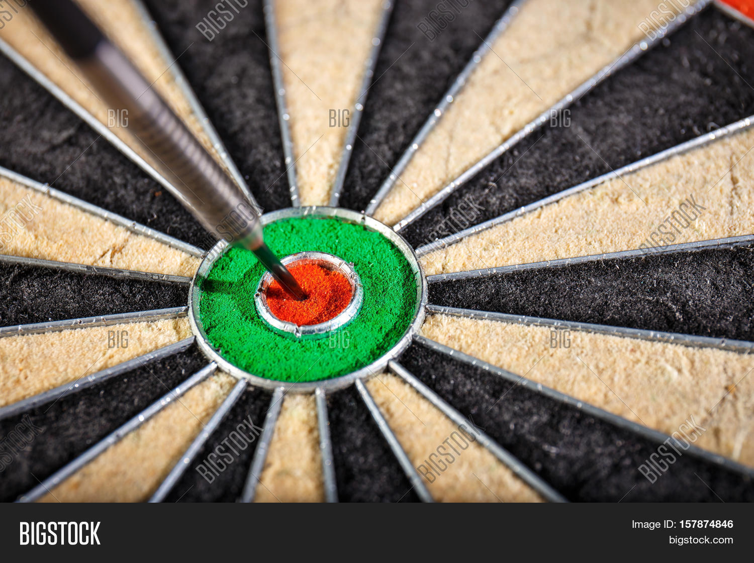 the darts in bulls eye close up