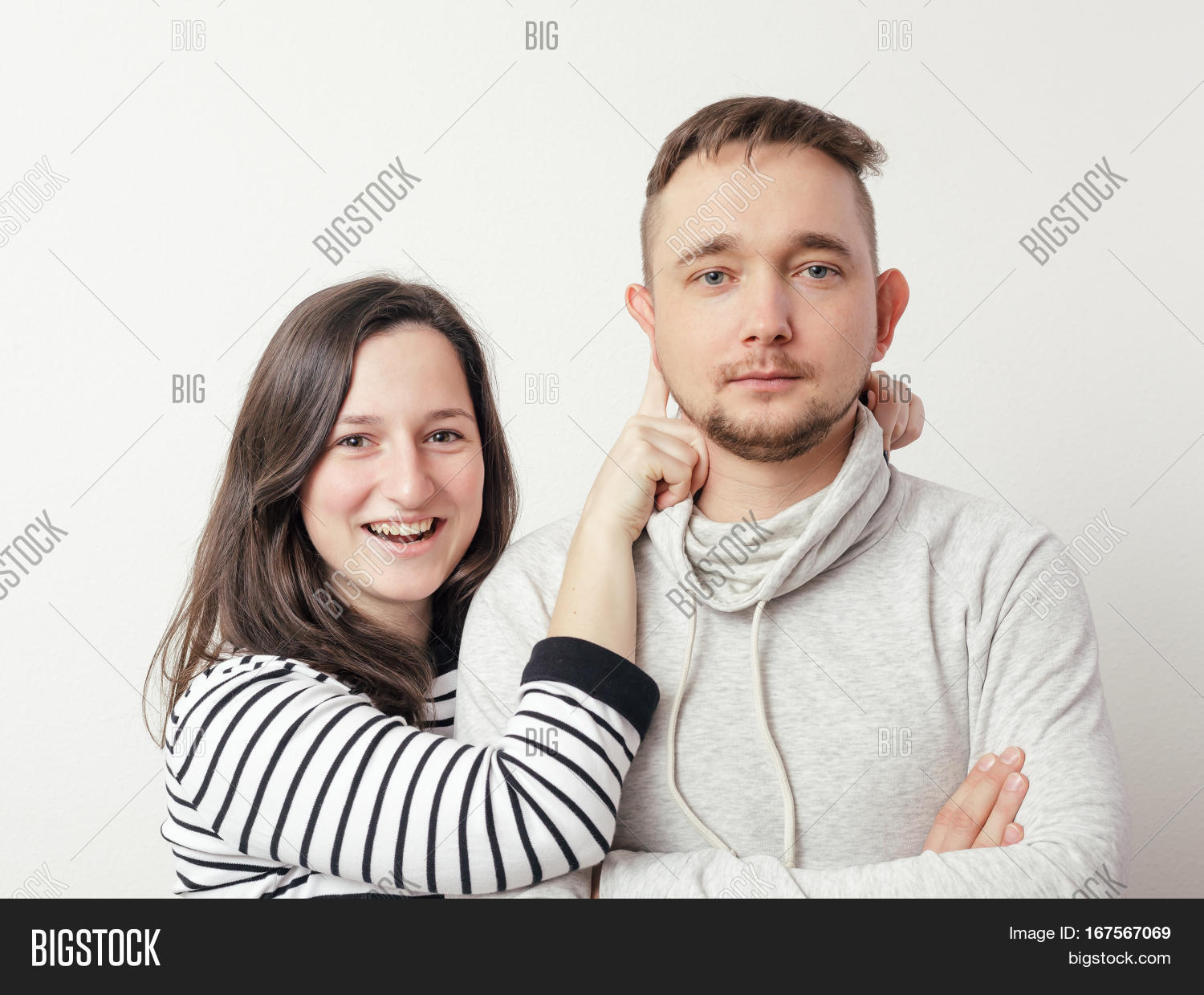 young couple in love have fun and pose for a family portrait