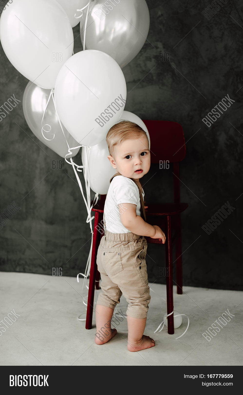 portrait of lovely little boy happy smiling celebrating 1 year
