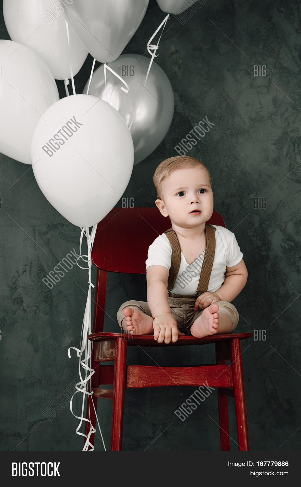 portrait of lovely little boy happy smiling celebrating 1 year