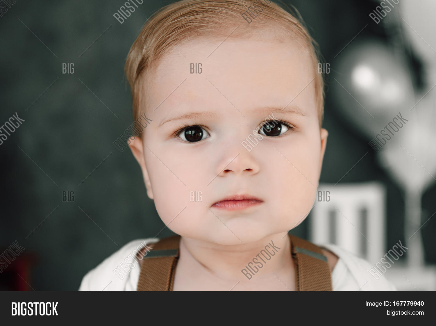 portrait of lovely little boy happy smiling celebrating 1 year