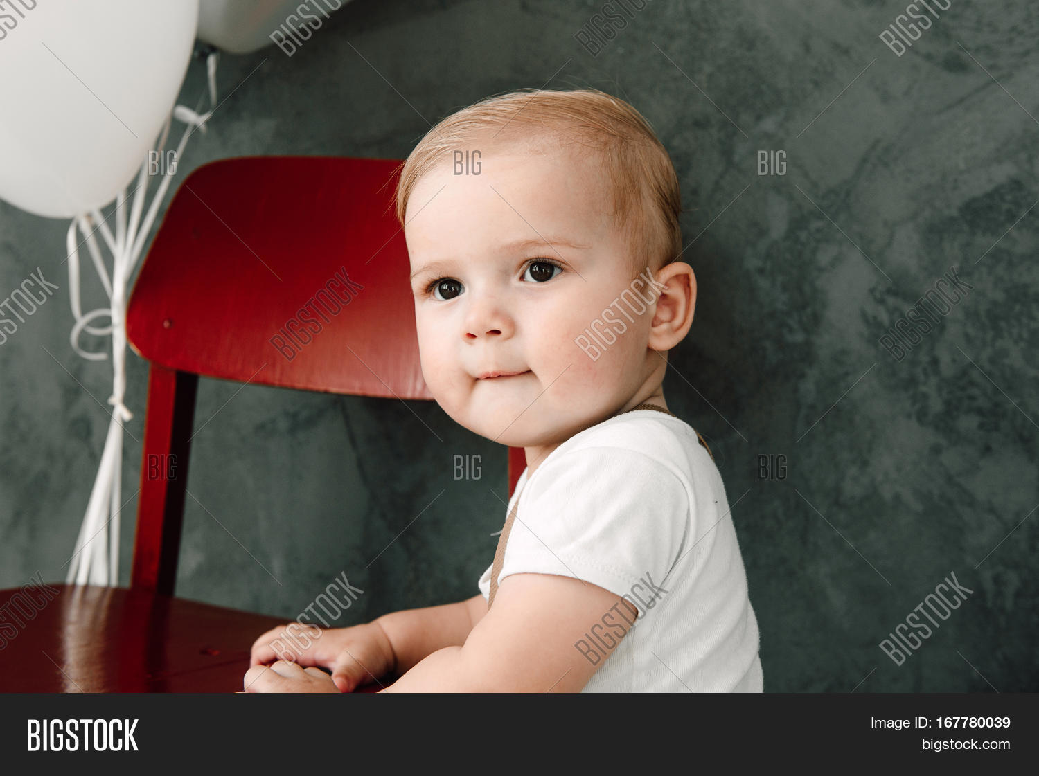 portrait of lovely little boy happy smiling celebrating 1 year
