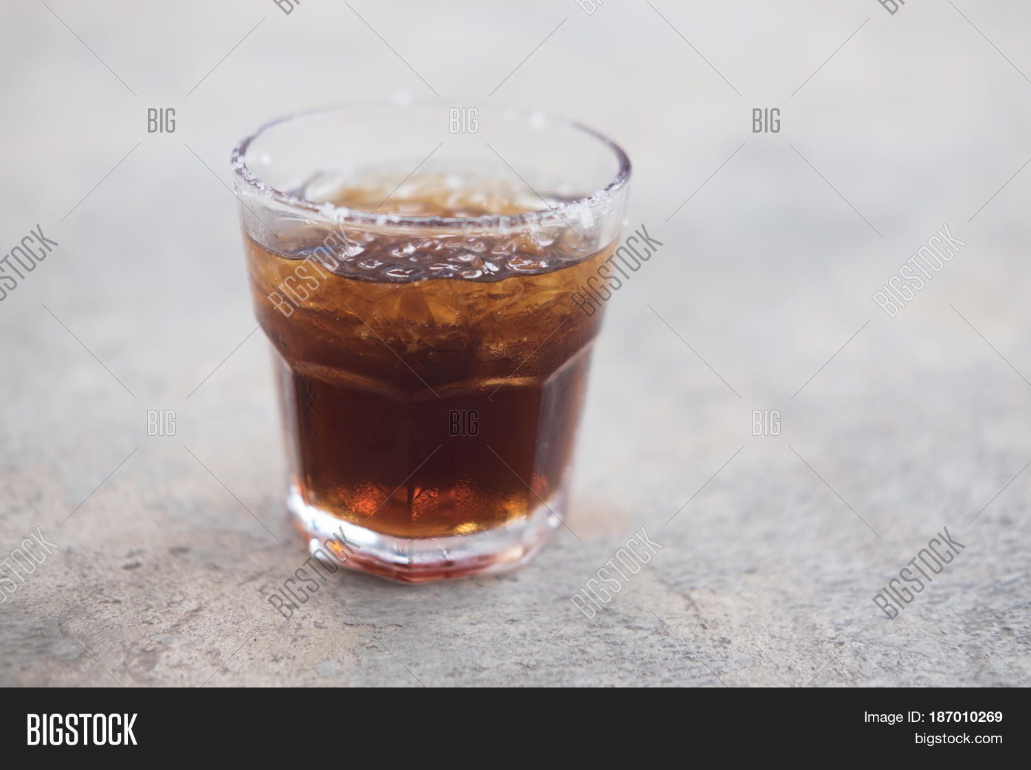 a glass of cola with ice for cool off in the summer