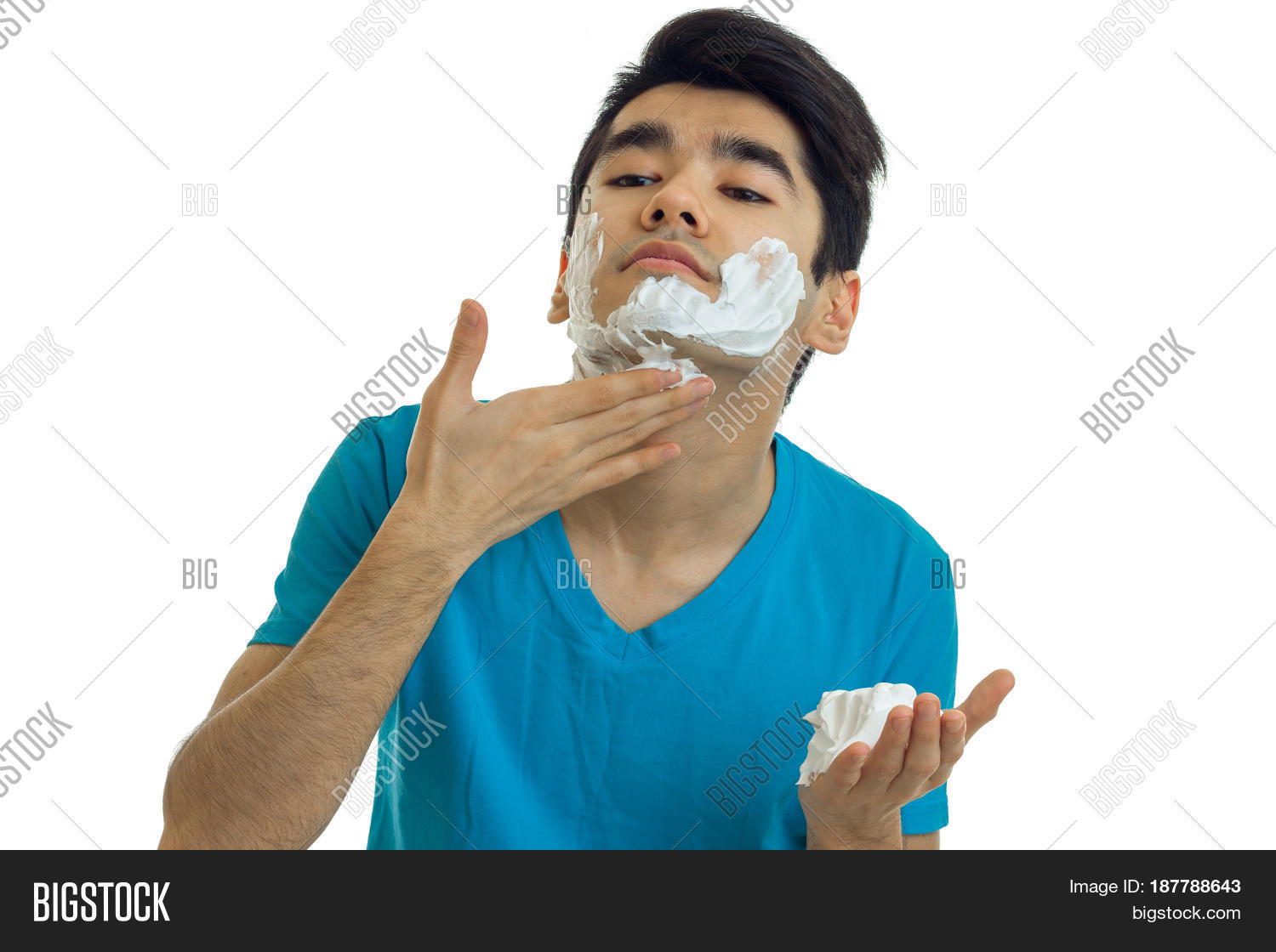 young funny guy with black hair raised his head and gently deals