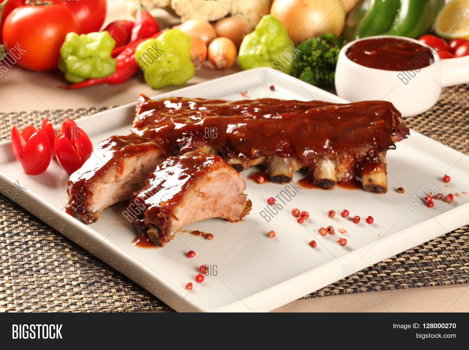 delicious roast pork rib won white dish. barbecue cream.