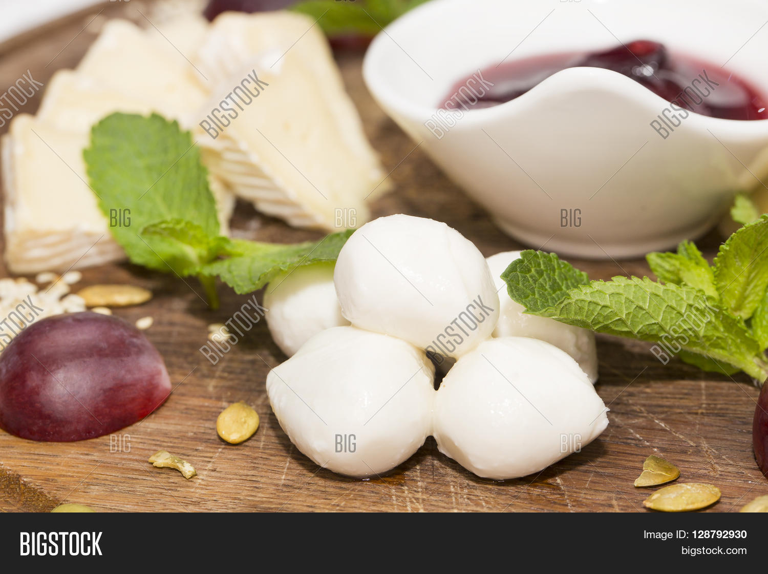 cheese plate with a large decorated the assortment of mint