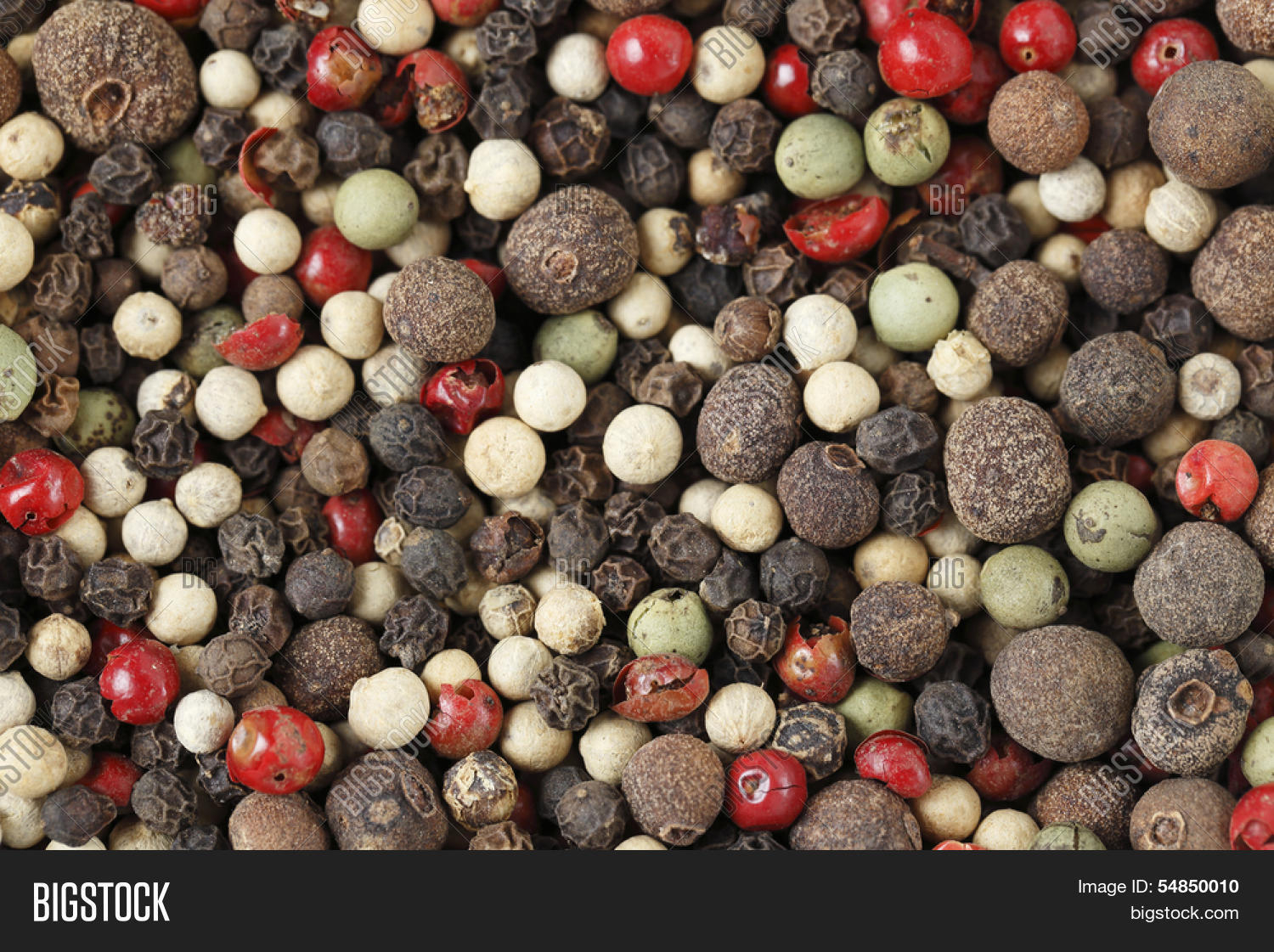 a mixture of different kinds of peppercorns, in