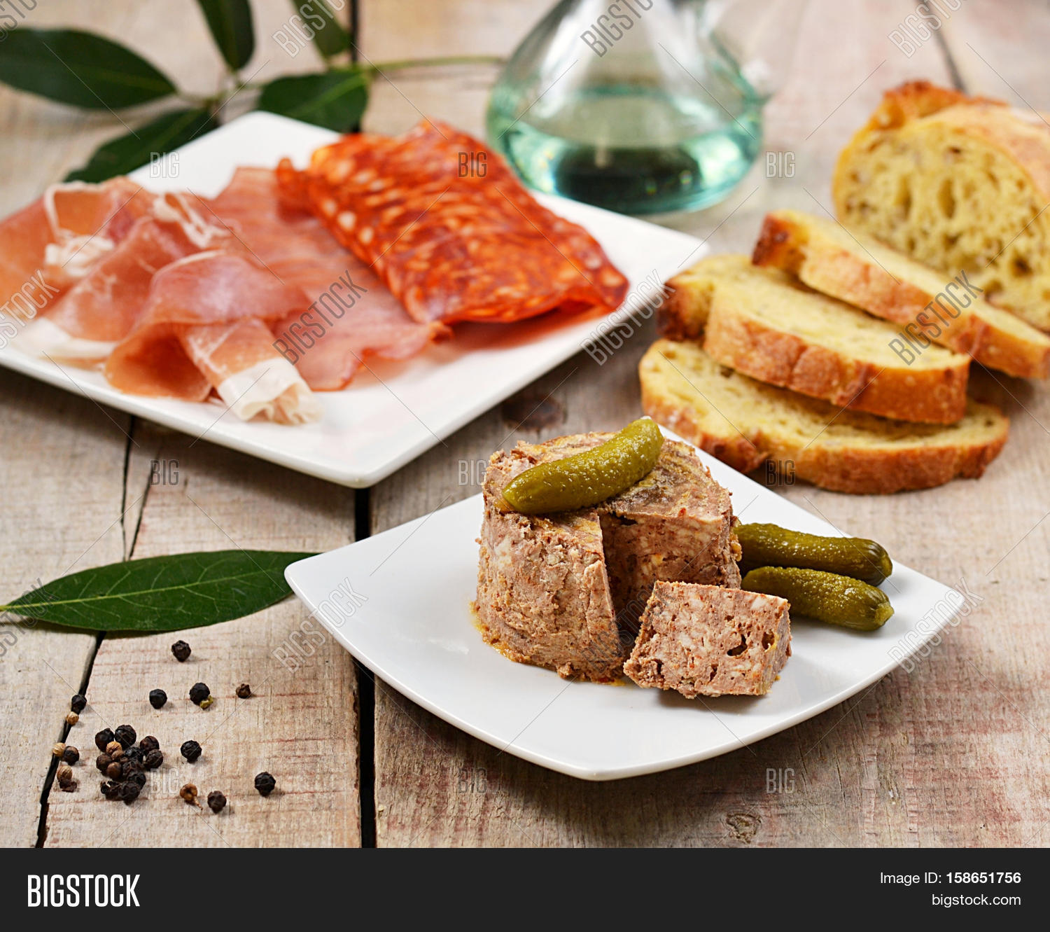 pork liver paste pté with pickles and tapas on wooden back