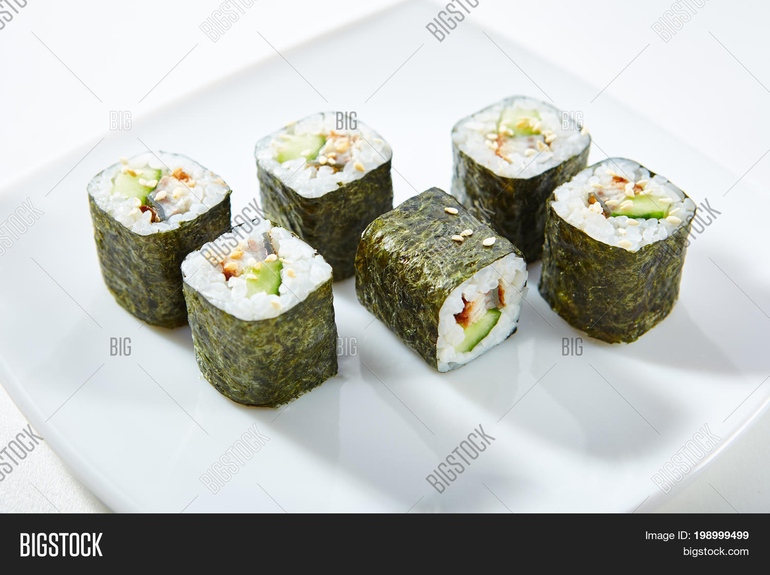 roll made of smoked eel and cucumber inside. nori outside