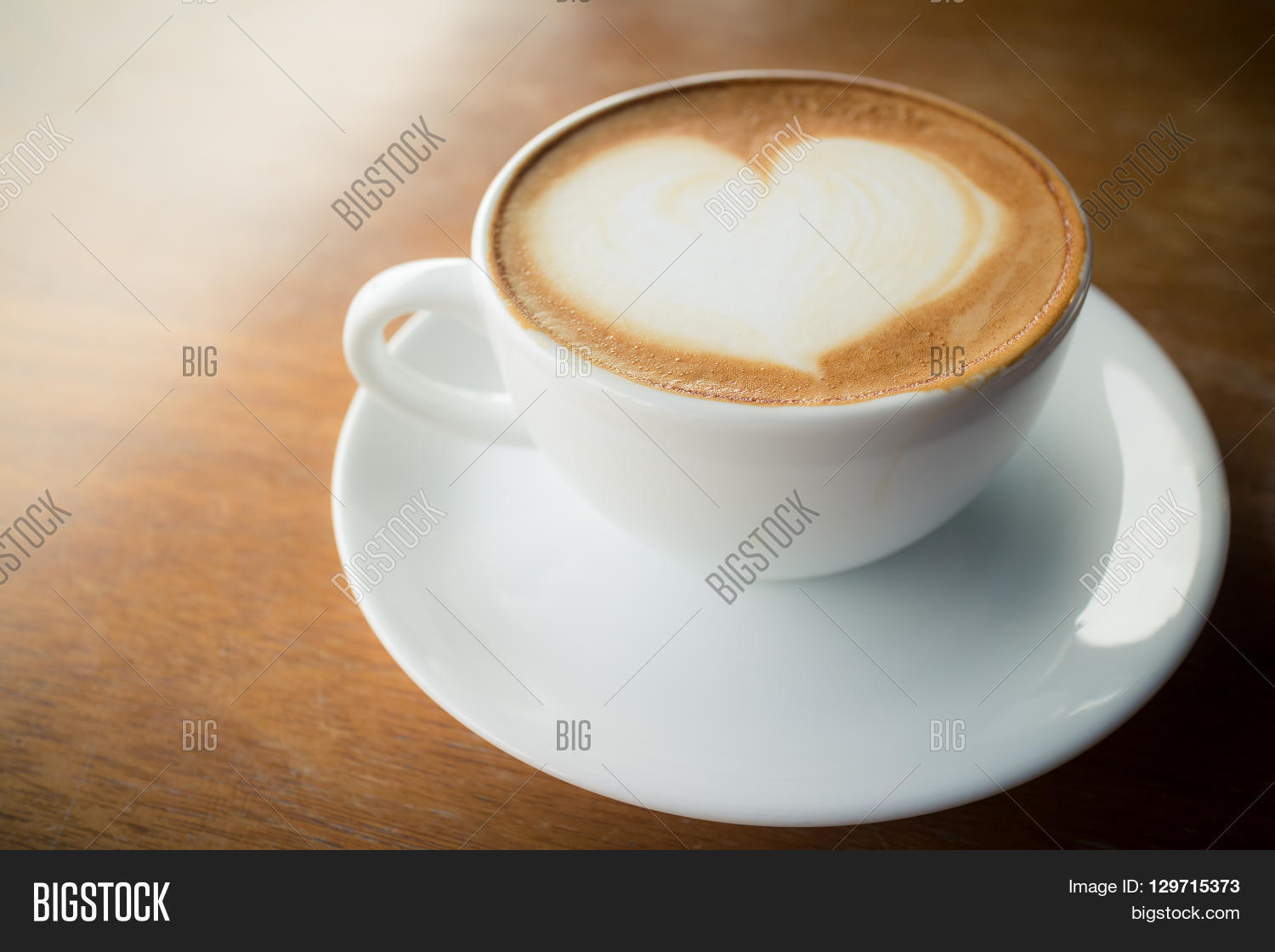 hot coffee with foam milk art of love(vintage effect)