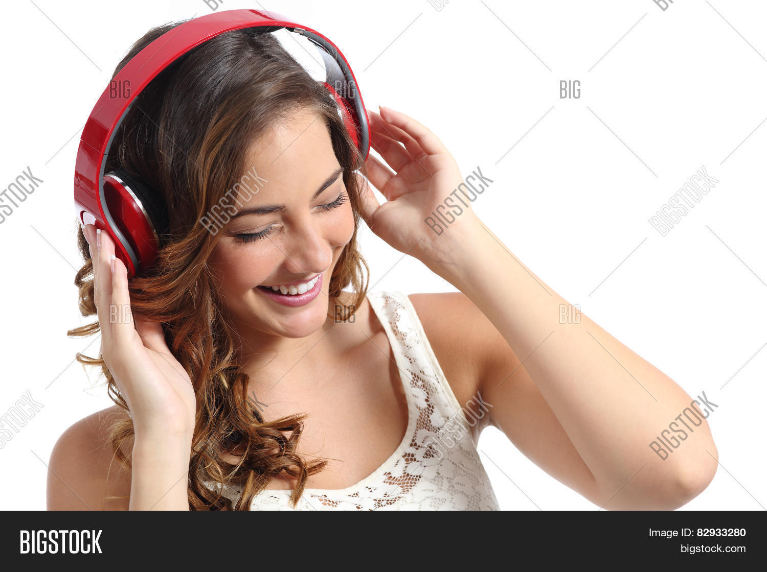 young happy woman enjoying listening to the music from
