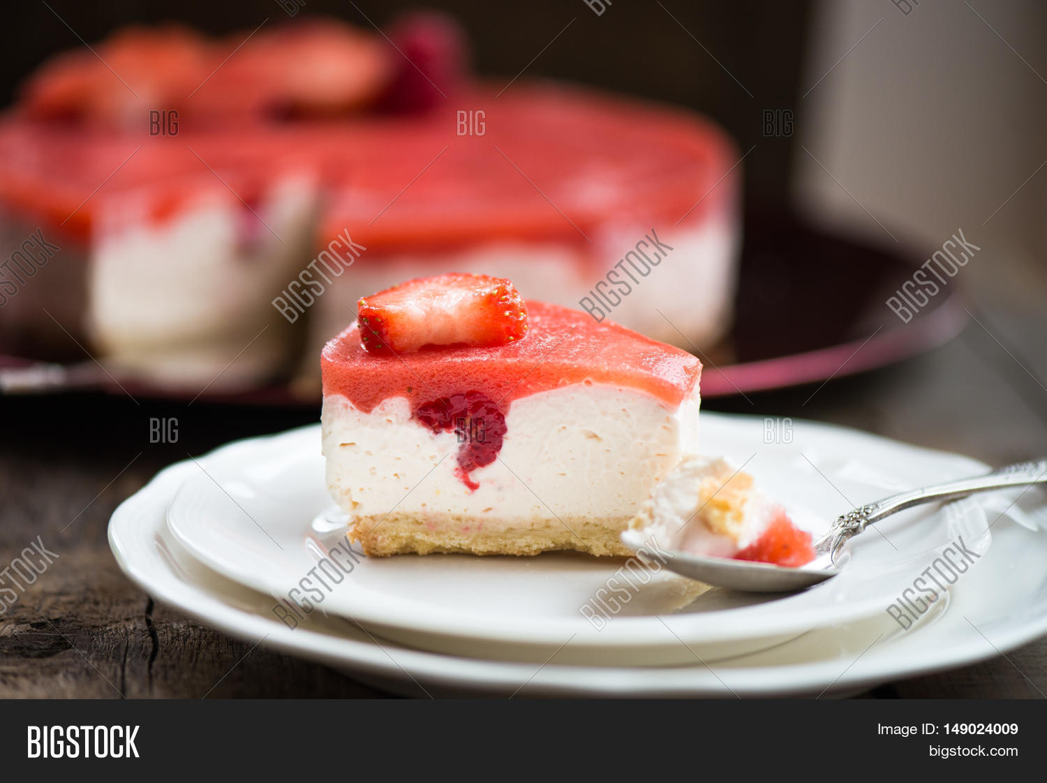 homebaked summer berry cheesecake with jelly on the top made